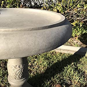 a close-up of a Kante Weathered Concrete Lightweight Traditional Birdbath