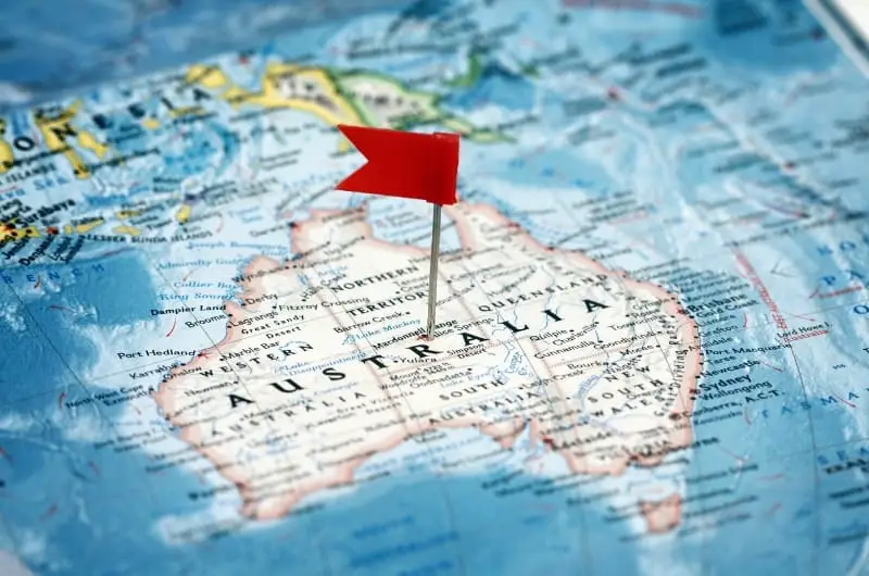 a map of Australia with a red flag pinned into the center