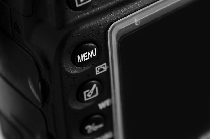 a close-up of a menu button on the back of a dslr camera
