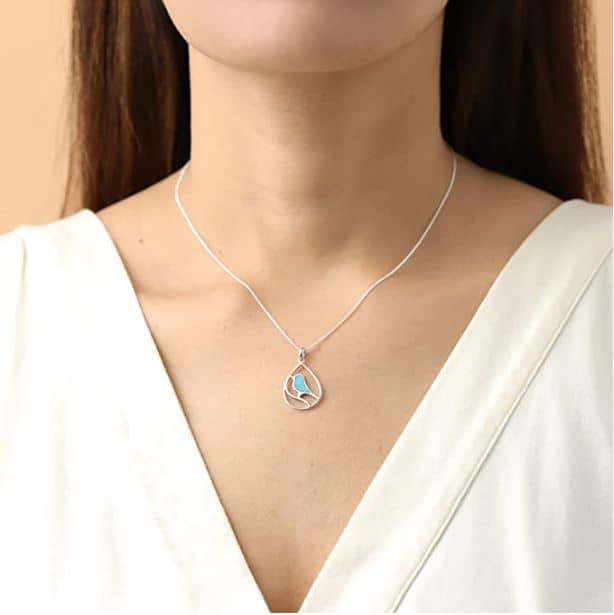 a woman wearing a sterling silver bird necklace cute bird gifts