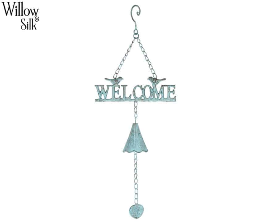 a hanging sign saying welcome with two birds on it