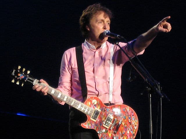 Paul McCartney on stage with his guitar