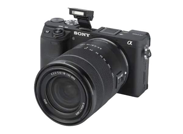 a Sony a6400 mirrorless camera with an 18-135mm lens attached to it