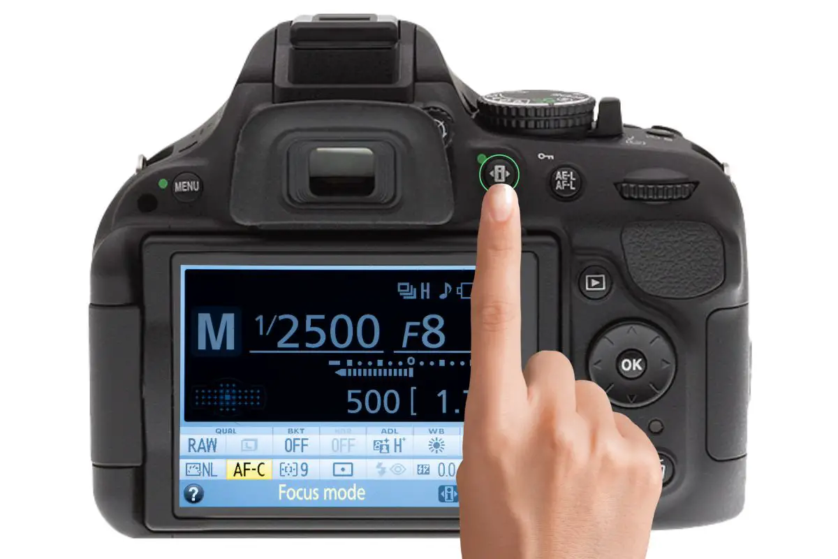 the rear of a Nikon D5200 showing the focus mode display with AF-C selected. A woman's hand is pressing the i button